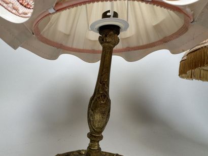 Two gilded, chiseled bronze bedside lamps...