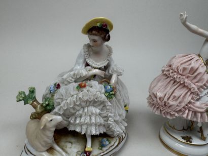 Two polychrome porcelain and gold figurines...