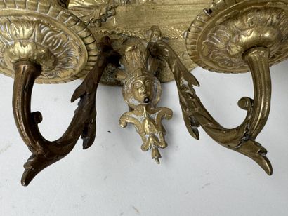 Pair of gilded bronze repoussé wall sconces...