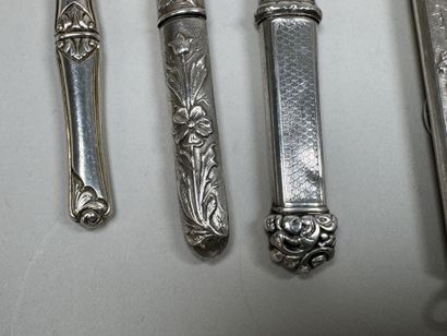 3 silver needle cases with chased and foliage...