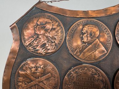 Large, coat-of-arms-shaped plaque made of...