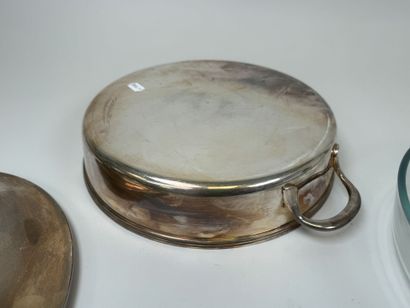 A large, silver plated metal-covered vegetable...