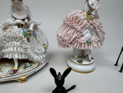 Two polychrome porcelain and gold figurines...