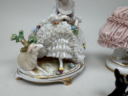 Two polychrome porcelain and gold figurines...