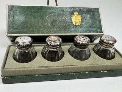 CHRISTOFLE.
4 cast-glass salt shakers with...