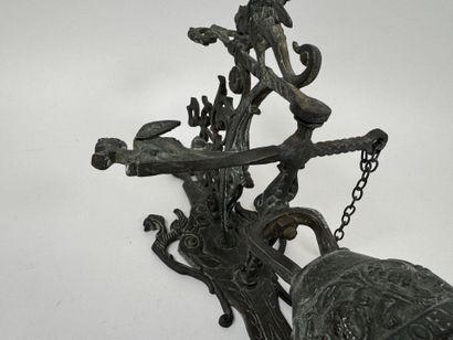 Bell and stand made of patinated bronze,...