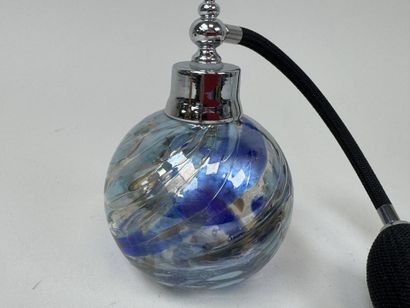 Colored glass perfume bottle and spray.
It...