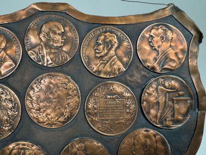 Large, coat-of-arms-shaped plaque made of...