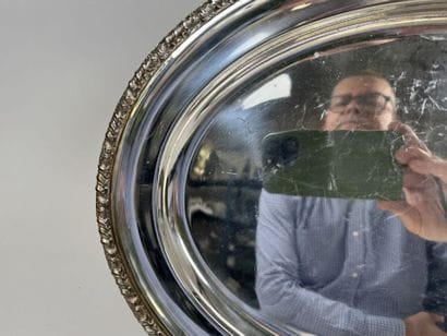 Two oval-shaped silver plated serving platters...