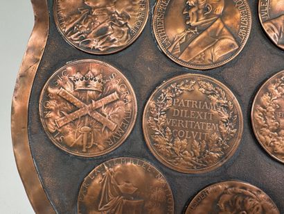 Large, coat-of-arms-shaped plaque made of...