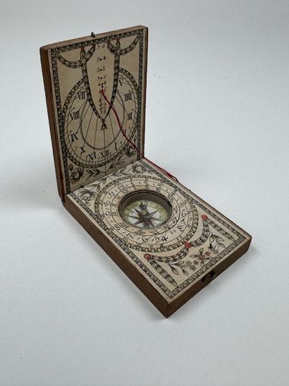 Small, fold-out pocket compass made of wood...