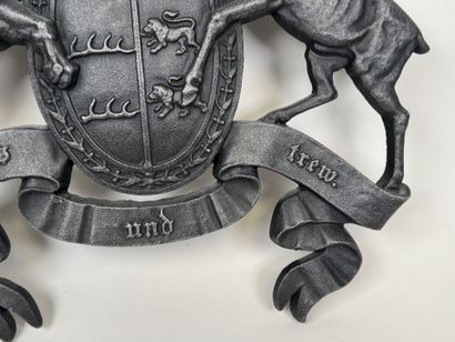 Large cast-iron coat of arms featuring the...