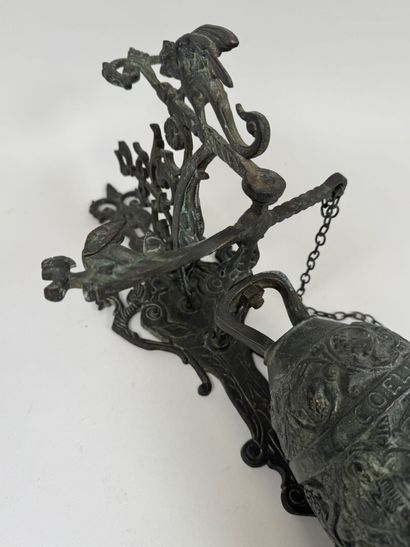Bell and stand made of patinated bronze,...