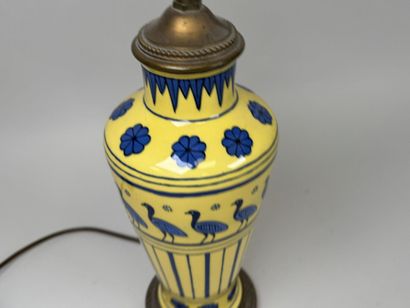 Yellow porcelain lamp decorated with birds...