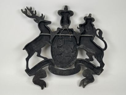 Large cast-iron coat of arms featuring the...