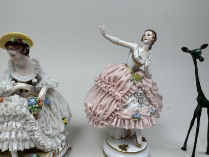 Two polychrome porcelain and gold figurines...