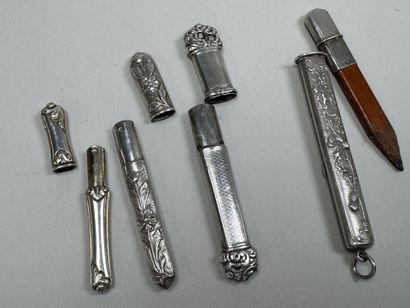 3 silver needle cases with chased and foliage...
