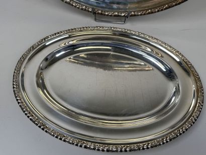 Two oval-shaped silver plated serving platters...