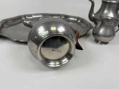 A coffee and tea service set made of pewter...