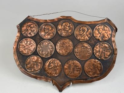 Large, coat-of-arms-shaped plaque made of...
