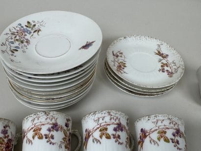 A set of polychrome and gold porcelain consisting...