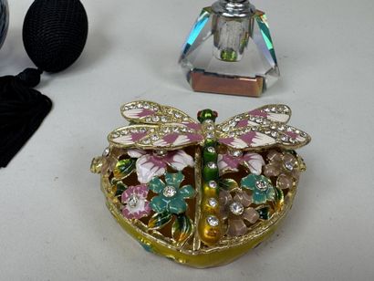 Colored glass perfume bottle and spray.
It...