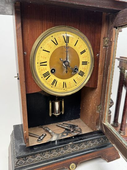 Wooden clock with chiseled brass ornamentation;...