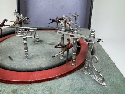 Horse race.
Circular mechanical toy with...