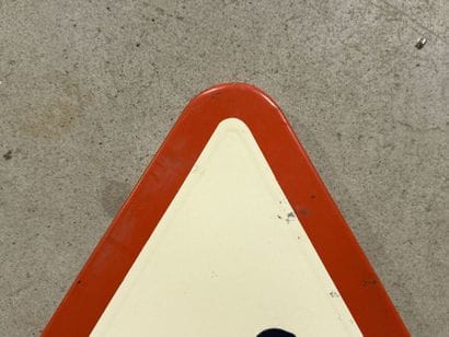 Triangular traffic sign made of polychrome...