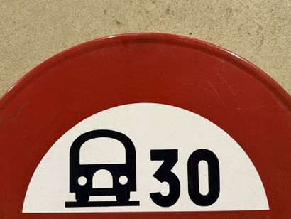 Round traffic sign made of polychrome enameled...