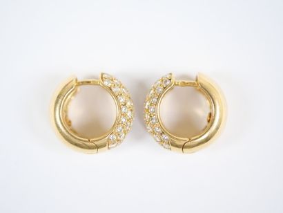 A pair of large hinged hoop earrings in 18K...