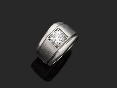A striking platinum ring featuring a half-size...
