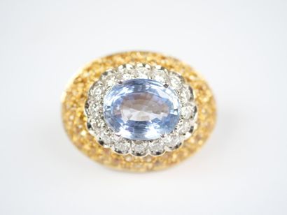 A striking pair of oval ear clips in 18K...