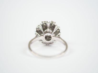 18K white gold (750‰) or platinum ring featuring...