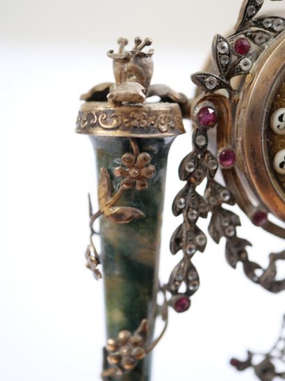A column-style table clock with scalloped...