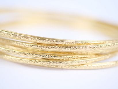 18K yellow gold (750‰) weekly bracelet consisting...