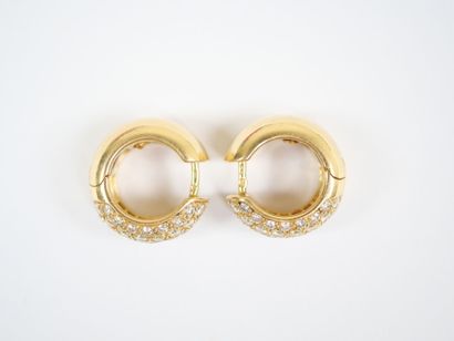 A pair of large hinged hoop earrings in 18K...