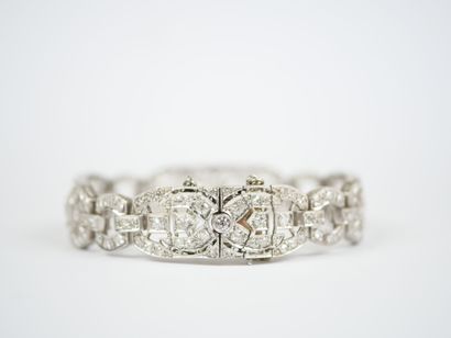 18K white gold link bracelet (750‰) and platinum...
