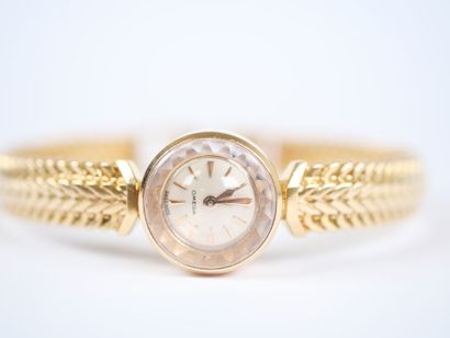 OMEGA. 
Ladies' watch with a round case and...