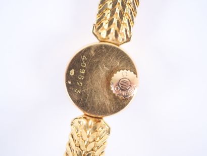 OMEGA. 
Ladies' watch with a round case and...