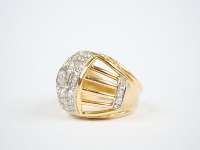 A large openwork dome ring in 18K yellow...