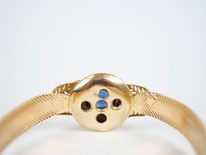 An 18K (750‰) yellow and white gold ribbon-link...