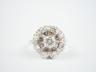 18K white gold (750‰) or platinum ring featuring...