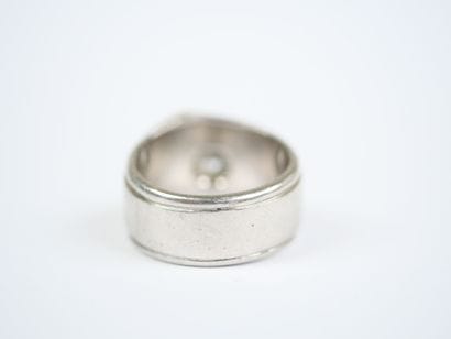 A striking platinum ring featuring a half-size...