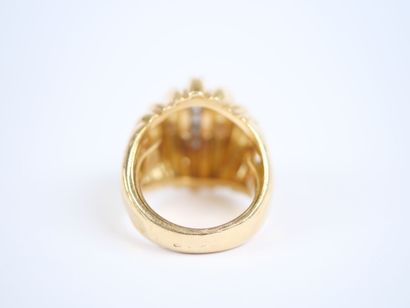 A large dome-shaped ring in 18K yellow gold...