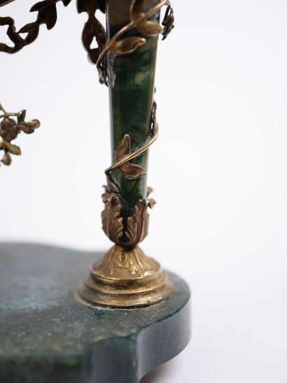 A column-style table clock with scalloped...