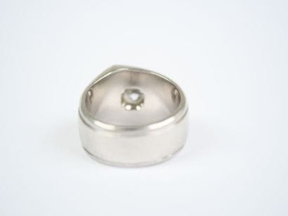 A striking platinum ring featuring a half-size...