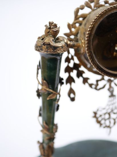 A column-style table clock with scalloped...