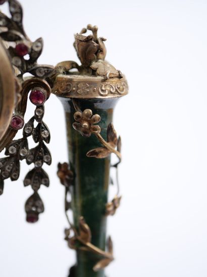 A column-style table clock with scalloped...