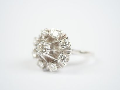 18K white gold (750‰) or platinum ring featuring...